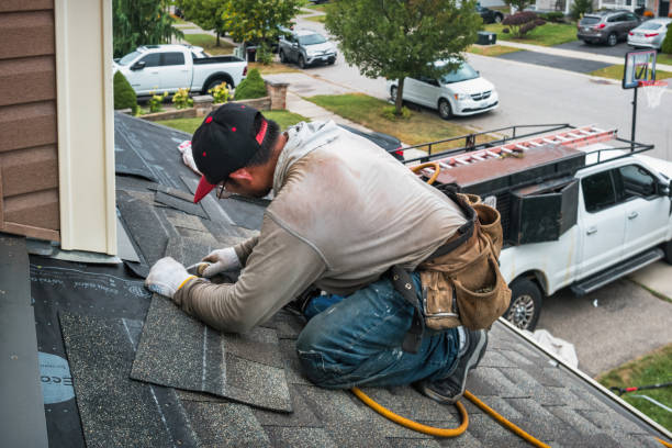 Professional Storm Damage Roof Repair technician working in Skidmore, TX